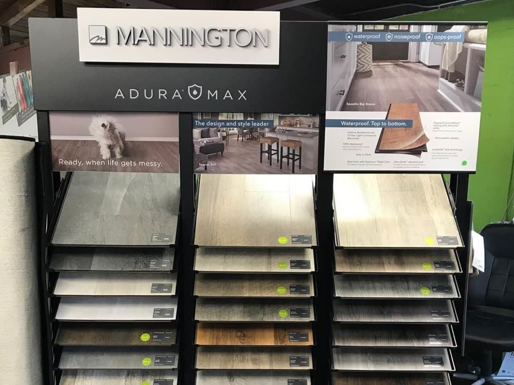 Inside the DRL Carpet & Flooring showroom with rows of carpet and flooring samples